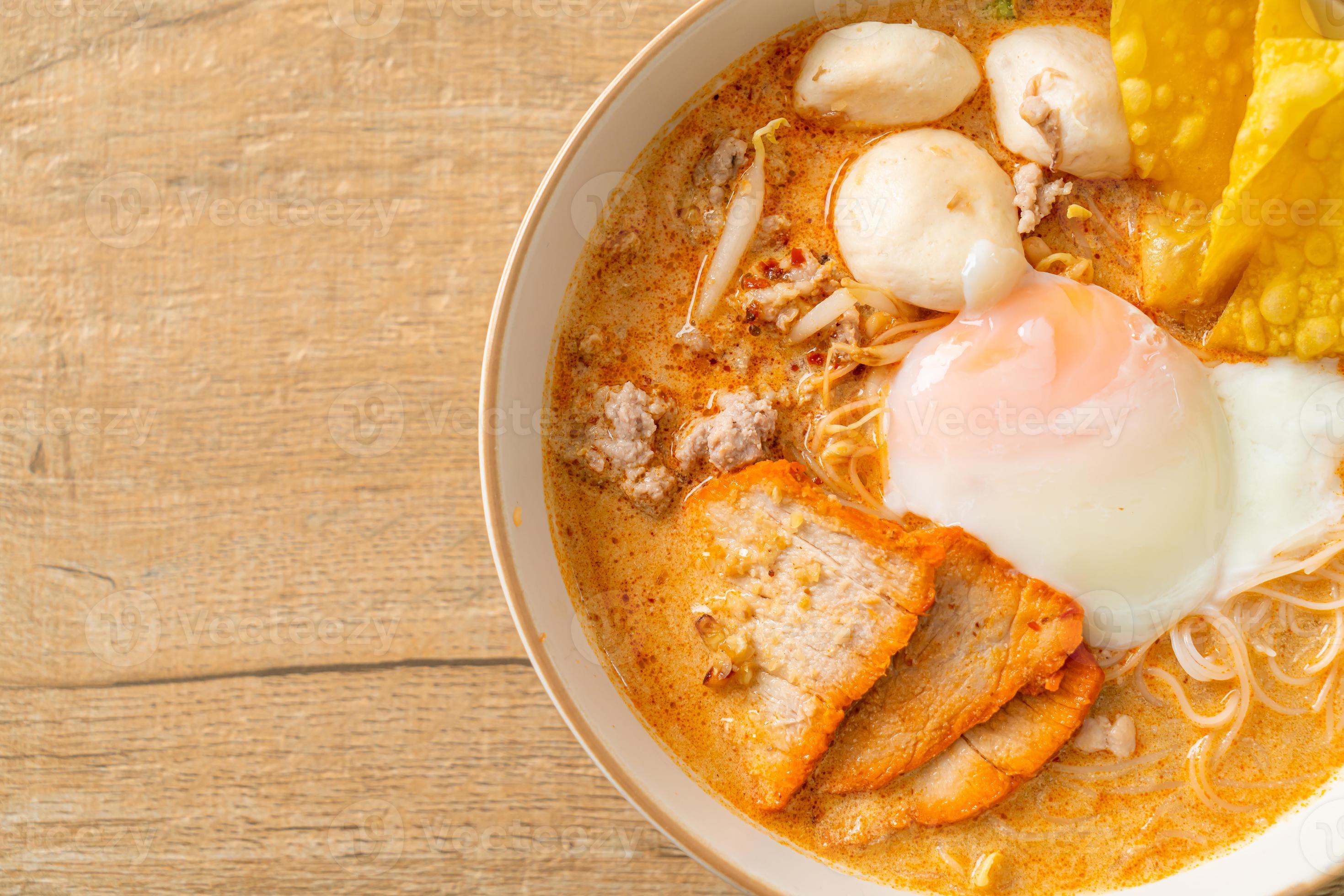 Rice vermicelli noodles with meatball, roasted pork and egg in spicy