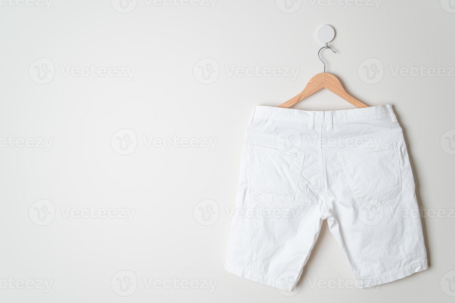 short pants hanging on wall photo