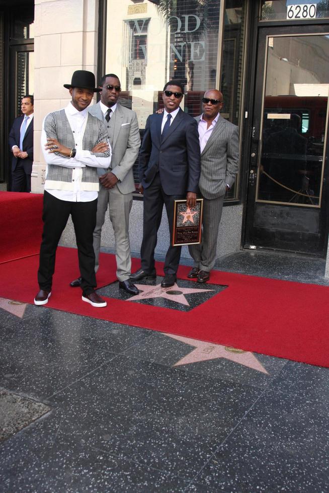 LOS ANGELES, OCT 10 - Usher, Sean Combs, Kenny Babyface Edmonds, Antonio LA Reid at the Kenny Babyface Edmonds Hollywood Walk of Fame Star Ceremony at Hollywood Boulevard on October 10, 2013 in Los Angeles, CA photo