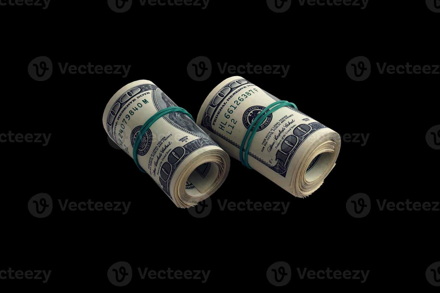 Bundle of US dollar bills isolated on black. Pack of american money with high resolution on perfect black background photo