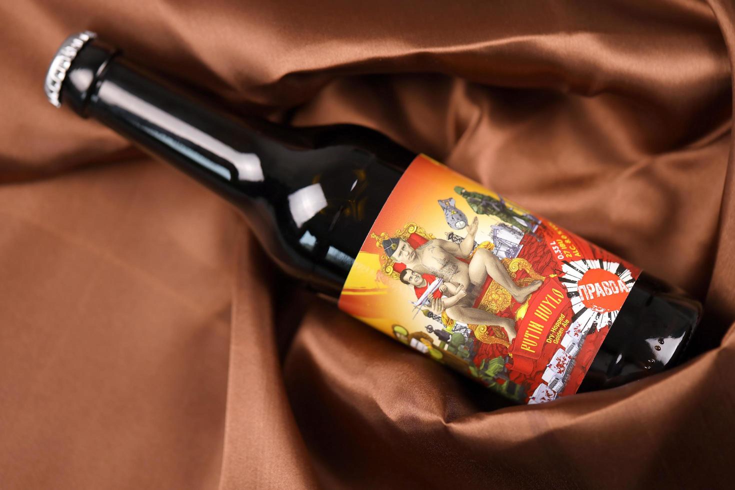 KHARKIV, UKRAINE - NOVEMBER 3, 2021 A bottle of beer featuring Russian President Vladimir Putin is called Putin Huilo literally Dickhead Putin brewed in Pravda Beer Theater in Lviv photo