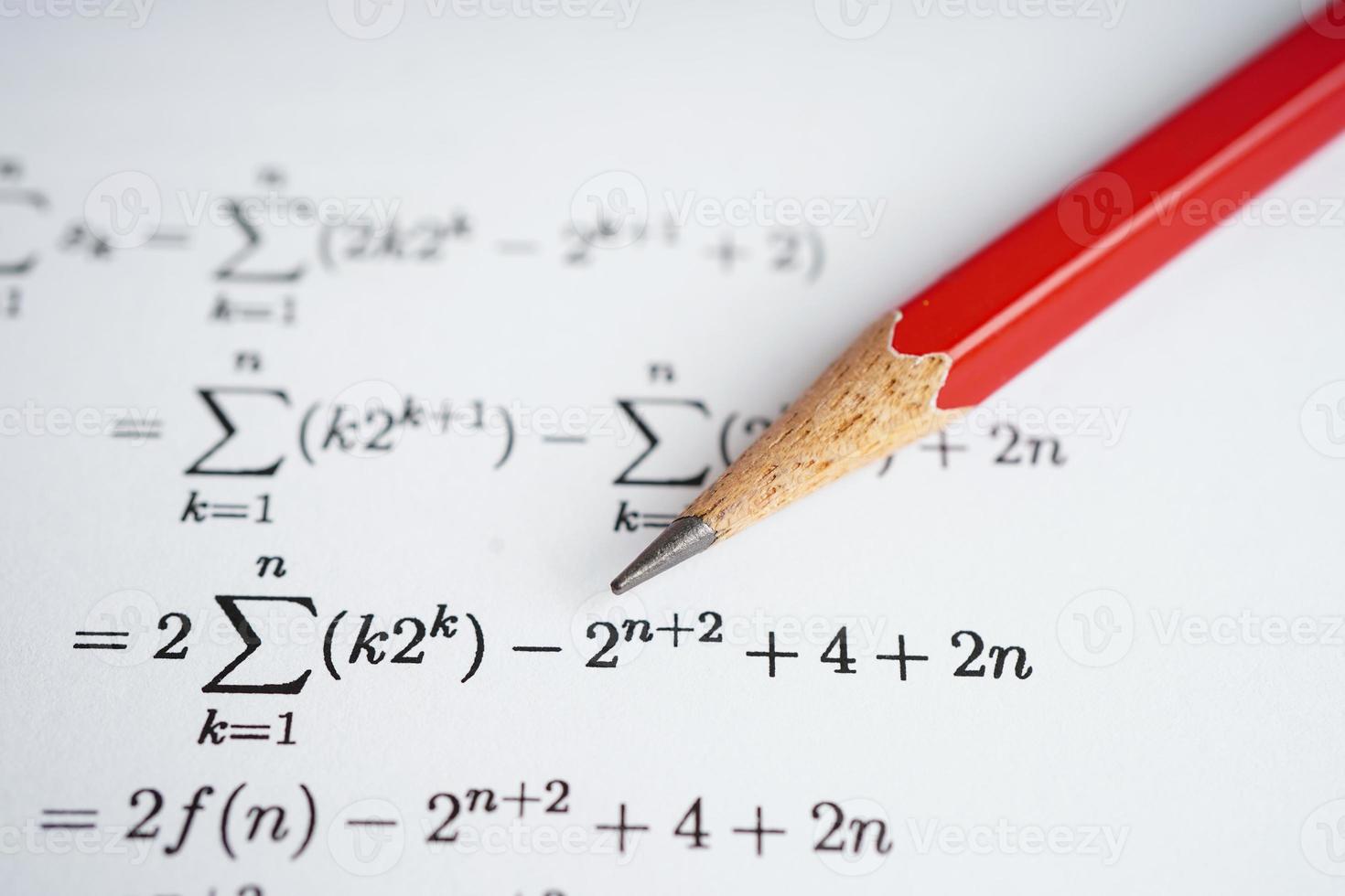 Pencil on mathematic formula exercise test paper in education school. photo