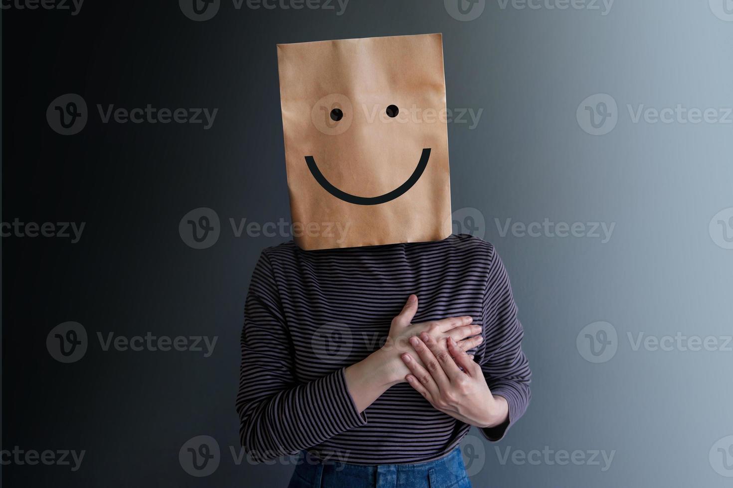 Customer Experience or Human Emotional Concept. Woman Covered her Face by Paper Bag and present Happy Feeling by Drawn Line Cartoon and Body Language photo