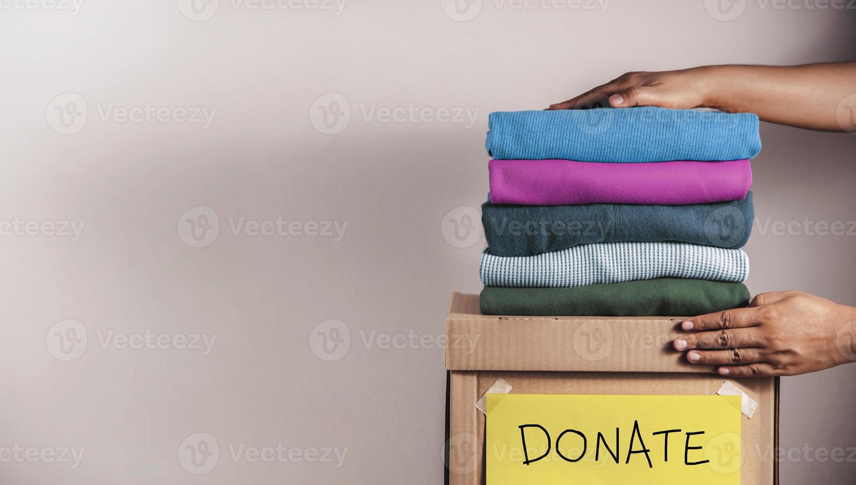 Clothes Donation, Renewable Concept.Box of Use Old Cloth. Preparing Garment at Home before Donate photo