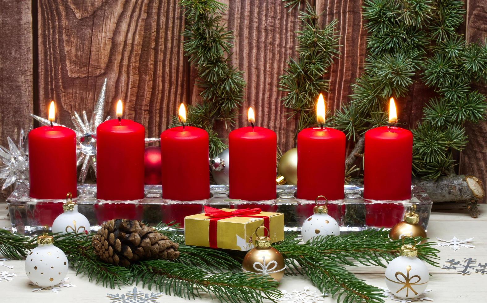 Red Christmas candles light flame fire. Christmas celebration concept. photo