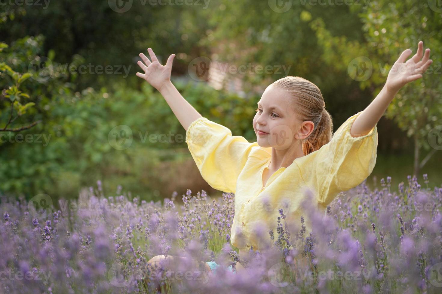 Beautiful little girl on lavender field. photo