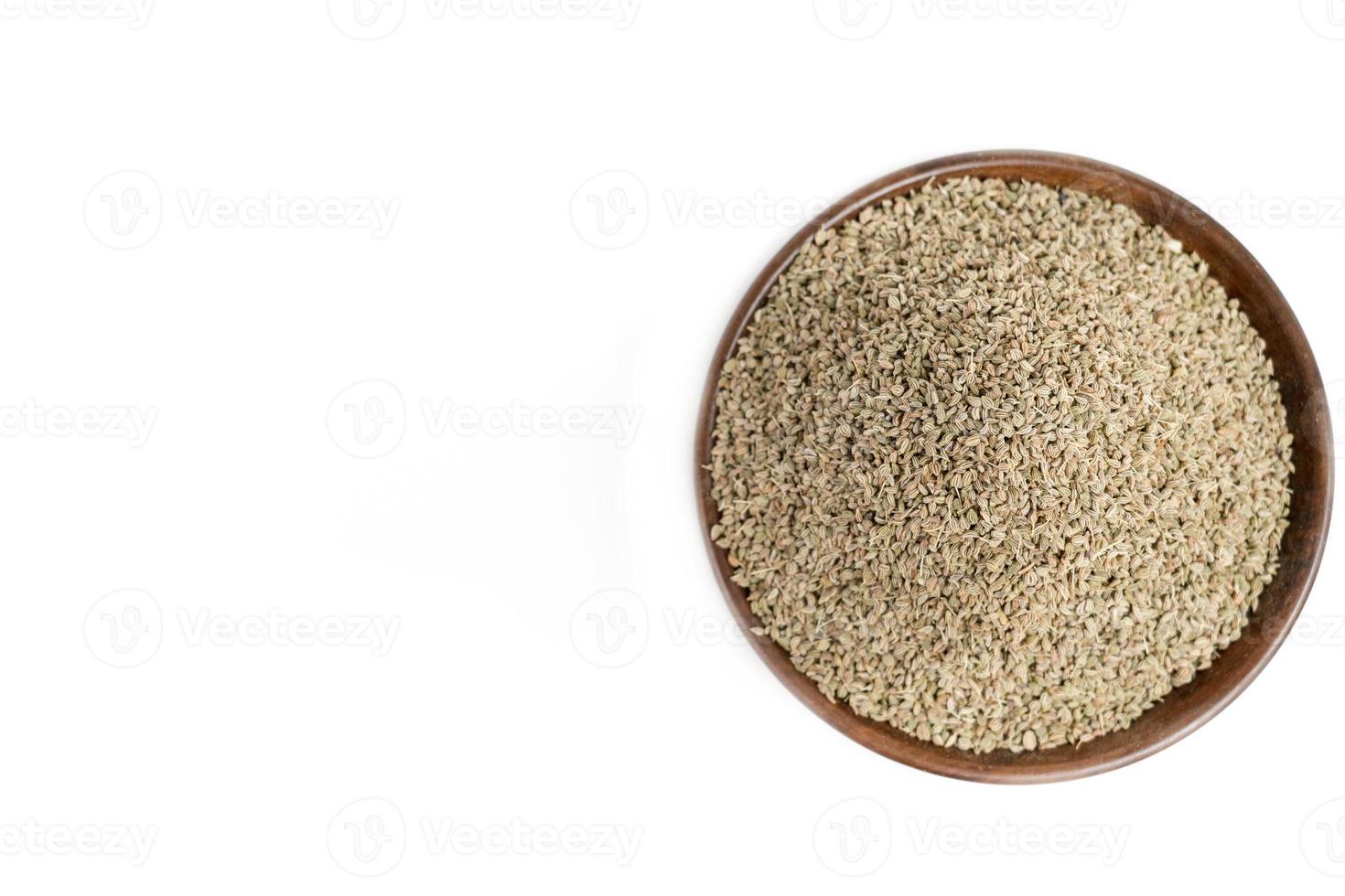Ajwain or Trachyspermum ammi,caraway herb spice seeds on white background photo