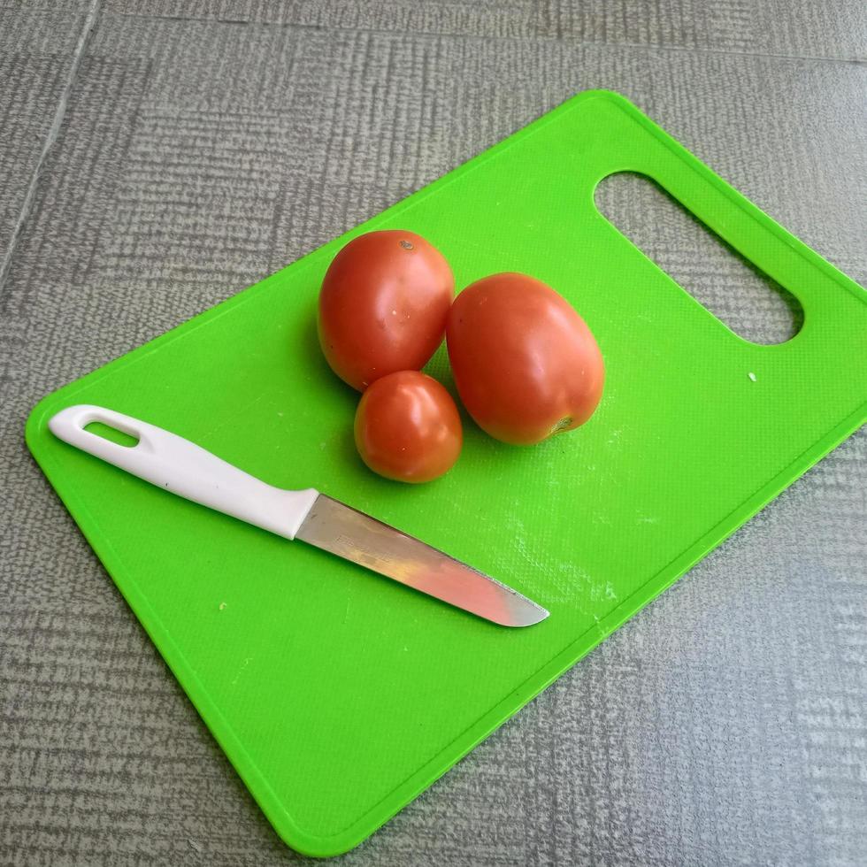 tomatoes, knives and chopsticks photo