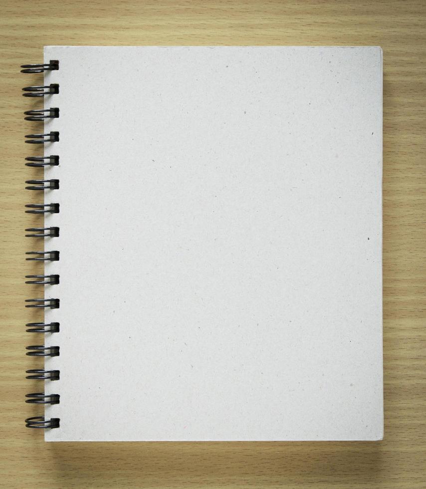 recycle notebook cover on wood background photo