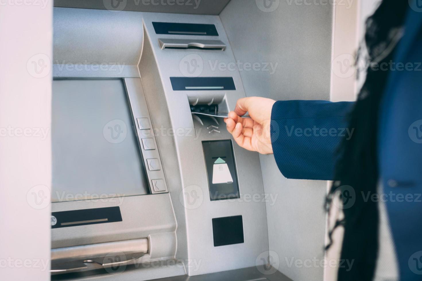 Close up of withdrawing money from ATM. photo