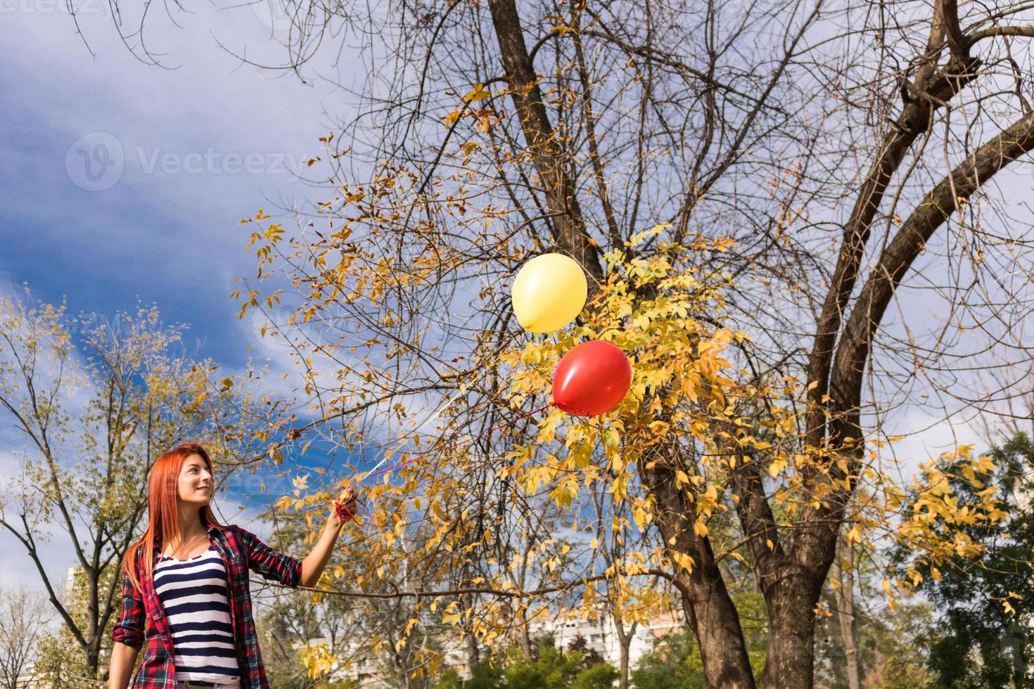 Colorful balloons in autumn day. photo