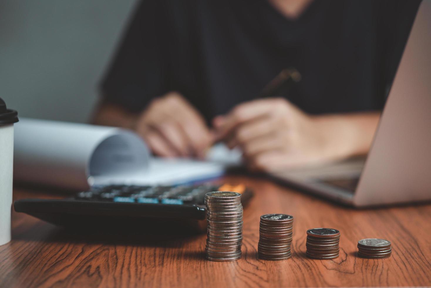 investment business growth saving currency financial plan finance wealth coin stack money document diagram paper banking retirement tax calculating chart data earning insurance manager. photo