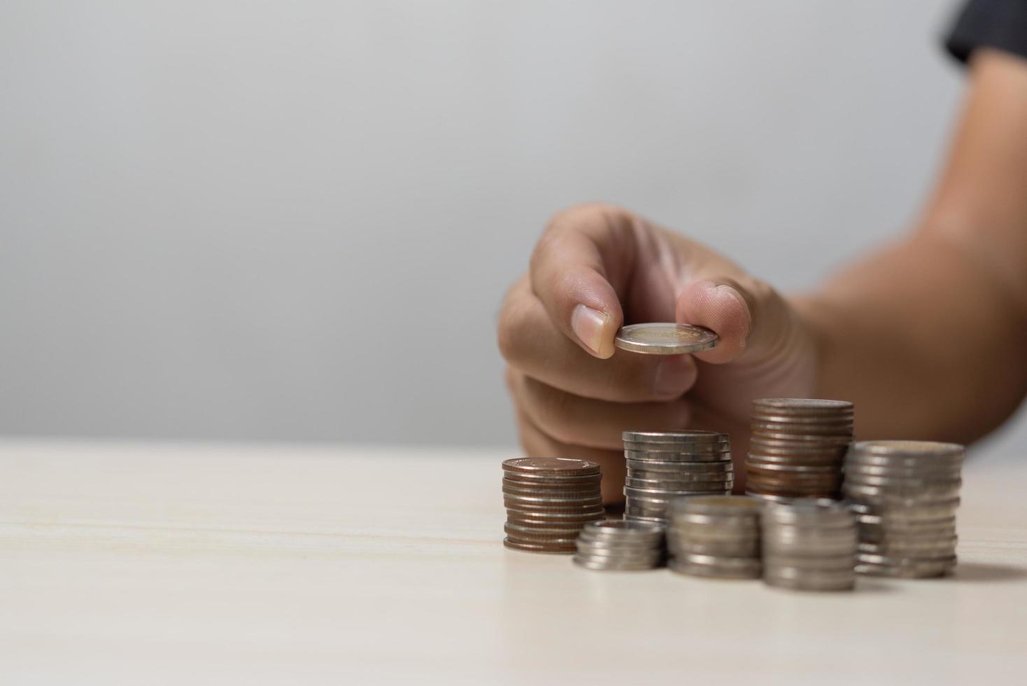 Finance investment saving wealth person holding a stack of coins business currency banking cash growth money. photo