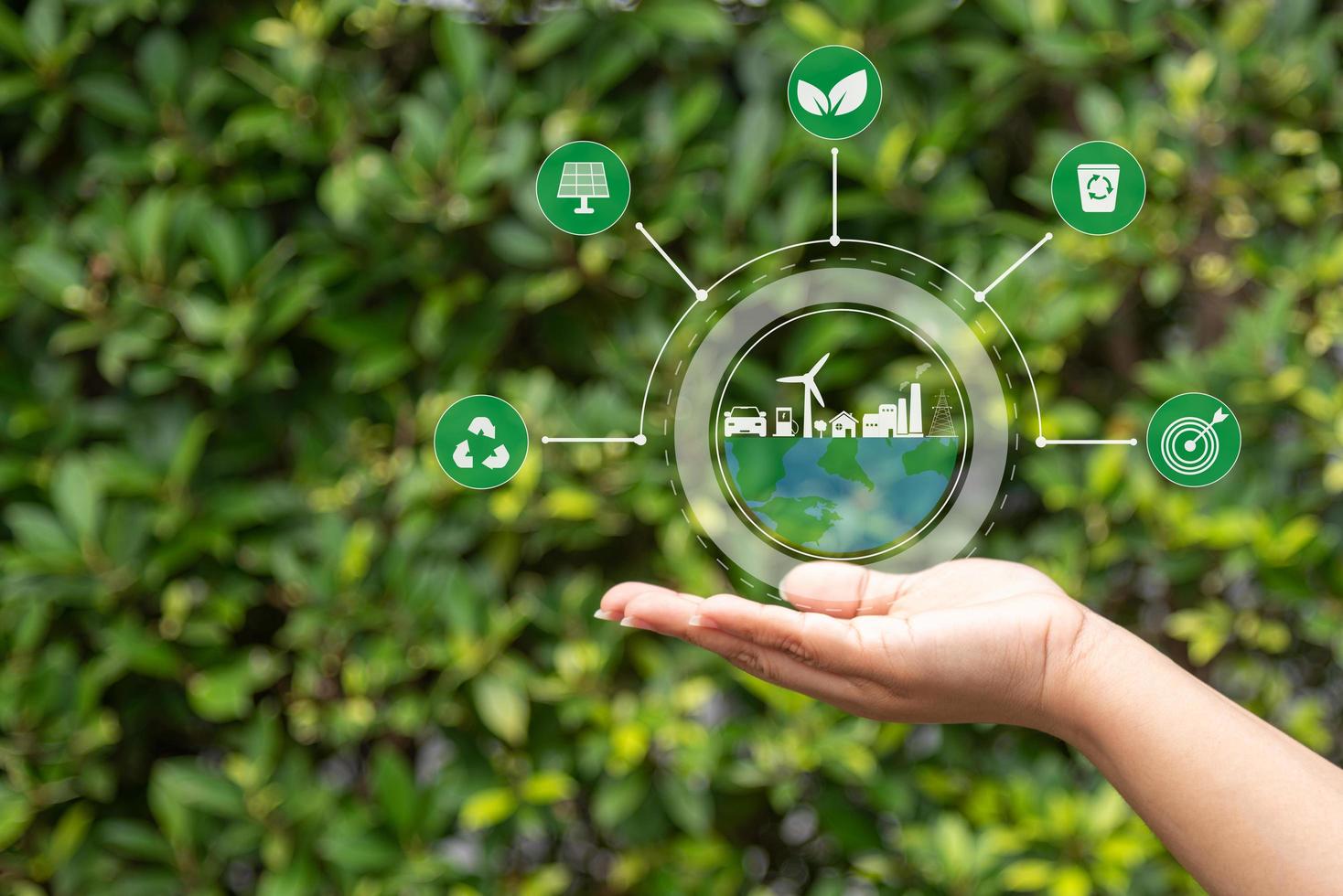 hand with environmental icons CO2 emission reduction icons global warming sustainable development and green business renewable energy clean and friendly environment concept. photo