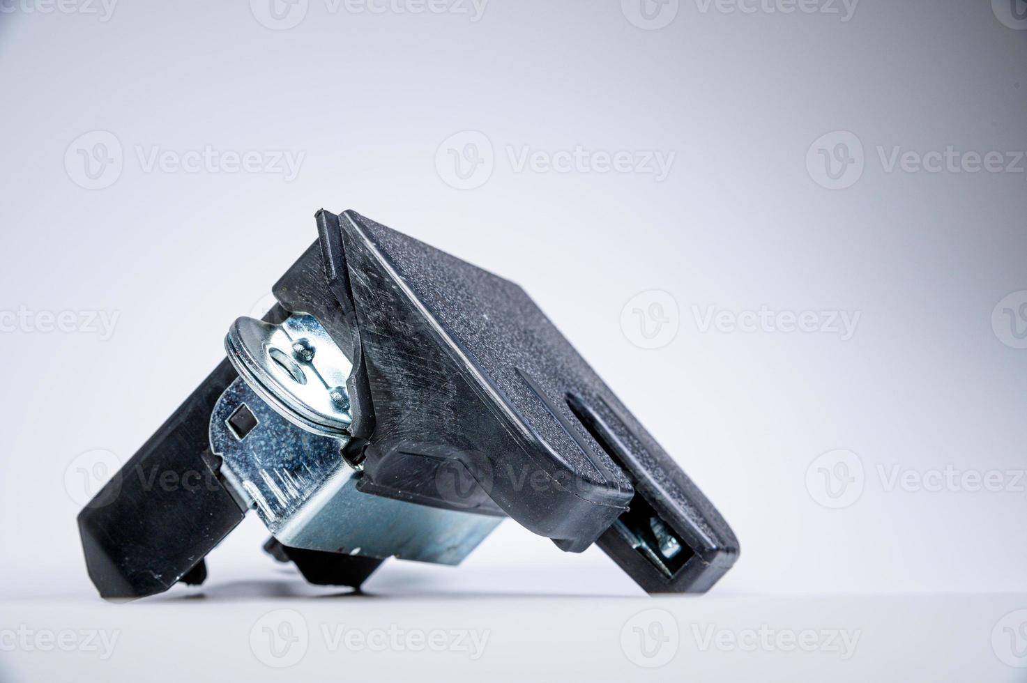 New tailgate lock with electric drive and plastic protection on a gray background photo