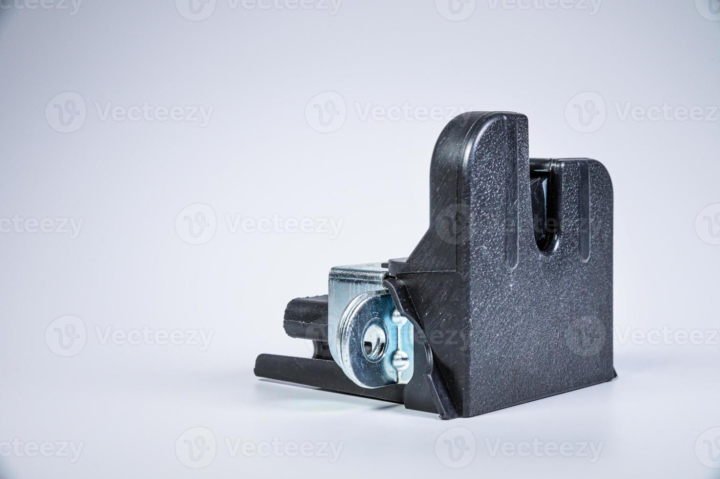 New tailgate lock with electric drive and plastic protection on a gray background photo