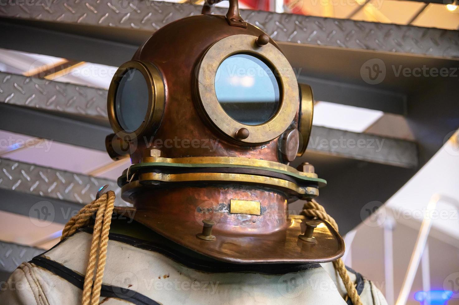 Close-up helmet Old vintage three-bolt deep-sea diving suit. Suit for deep sea diving of the last century. The history of the study of the underwater world photo