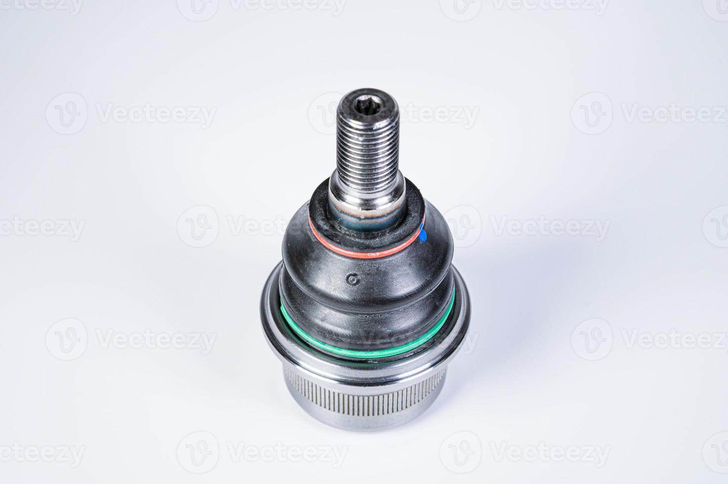 New spare parts spherical ball joints of a suspension bracket of a car on a gray background photo