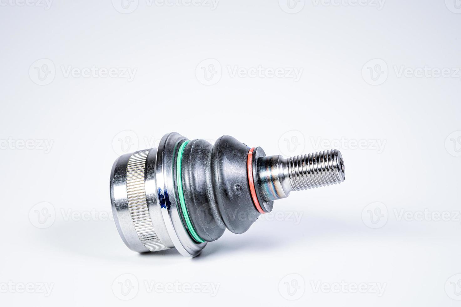 New spare parts spherical ball joints of a suspension bracket of a car on a gray background photo