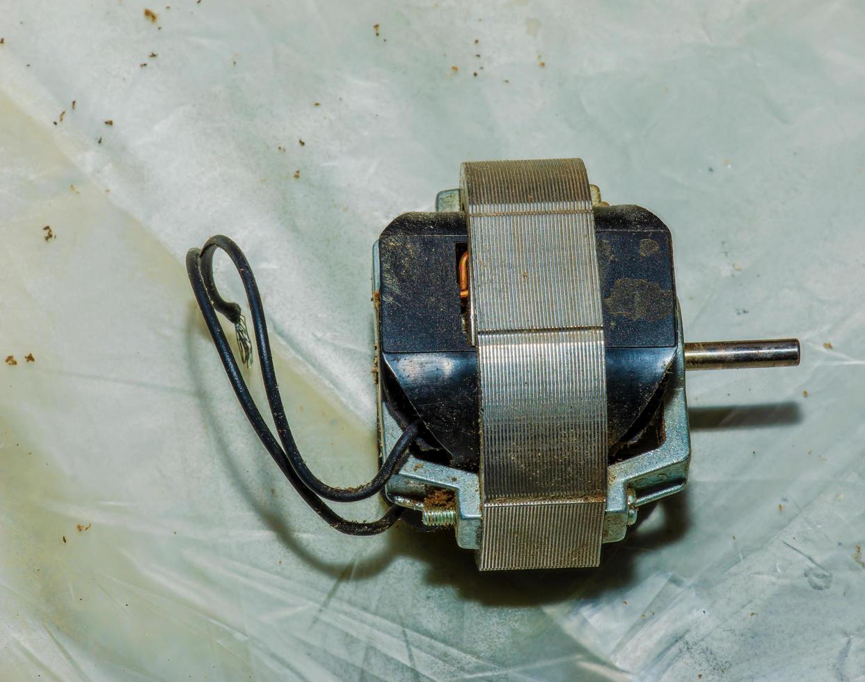Close-up of a very dirty kitchen exhaust fan. Fan before preventive cleaning and washing. Dirty details photo