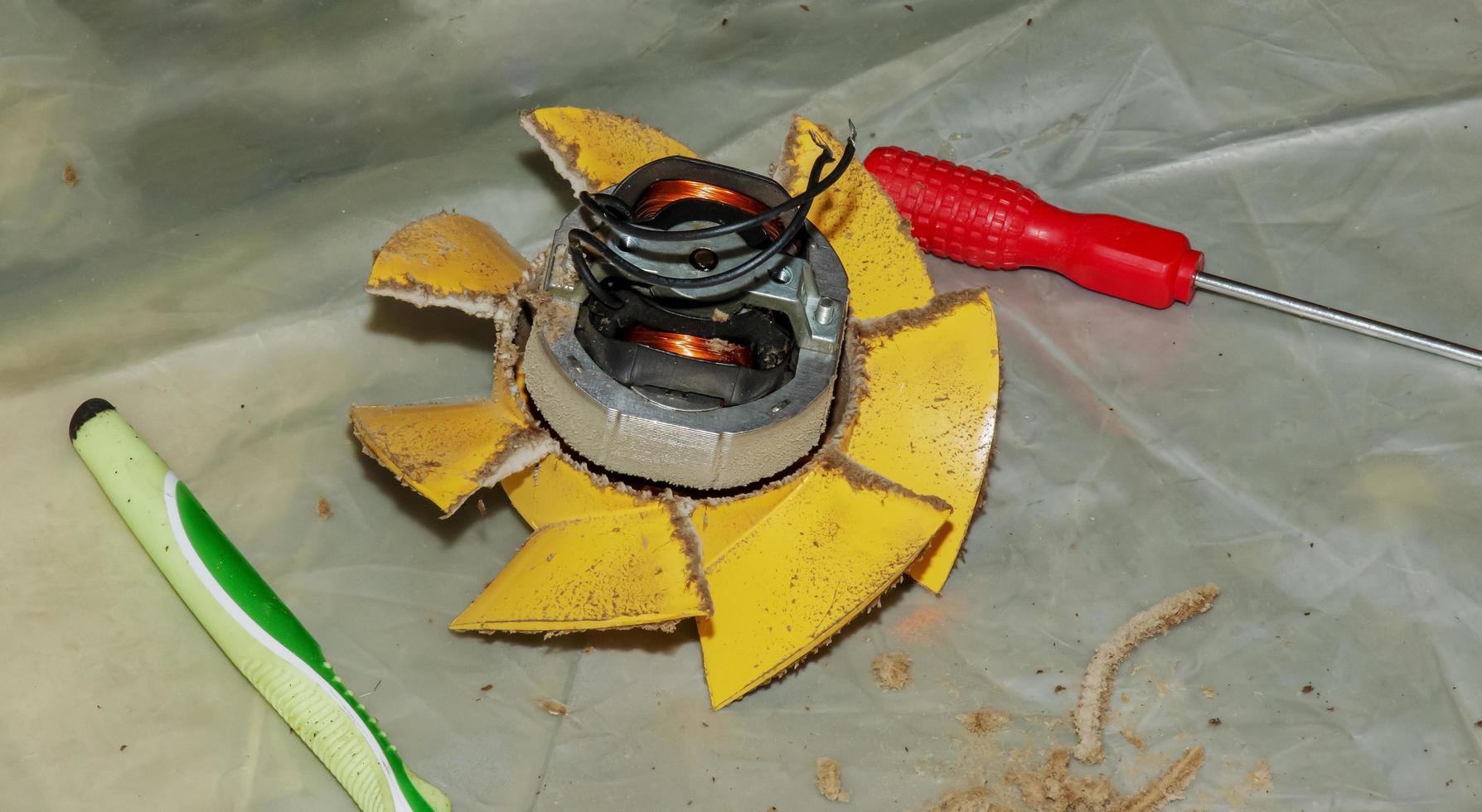 Close-up of a very dirty kitchen exhaust fan. Fan before preventive cleaning and washing. Dirty details photo