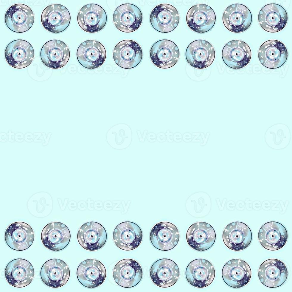 Many used spray cans for graffiti drawing lies on a pastel colored backgroung. Street art painting concept. Minimal flat lay pattern. Top view photo