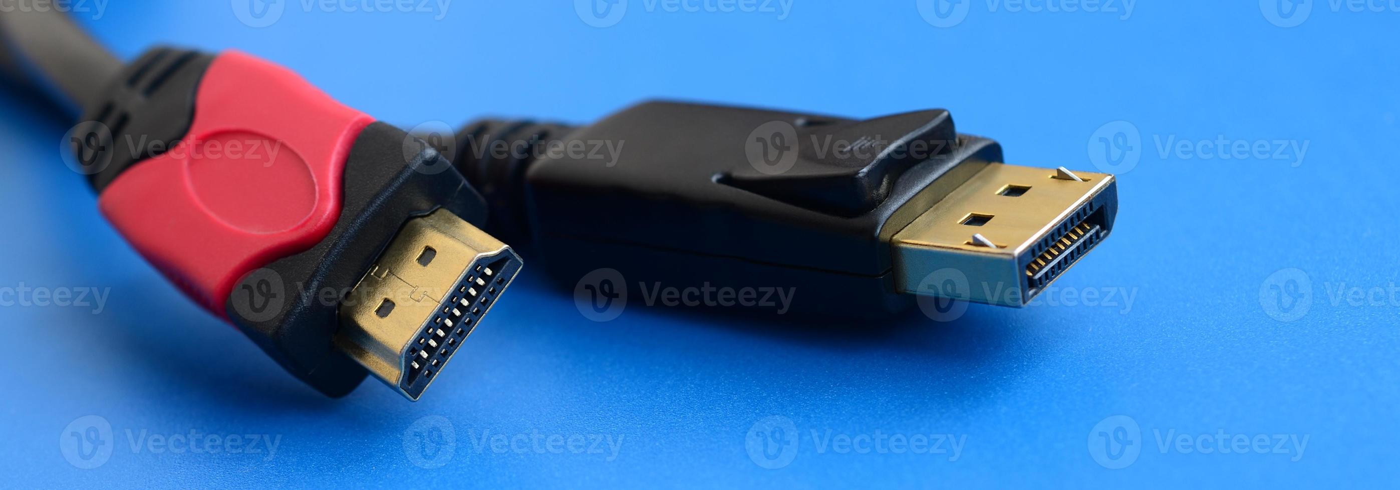 Audio video HDMI computer cable plug and 20-pin male DisplayPort gold plated connector for a flawless connection on a blue background photo