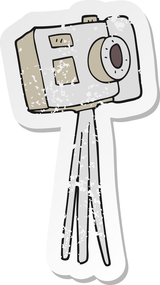 retro distressed sticker of a cartoon camera on tripod vector