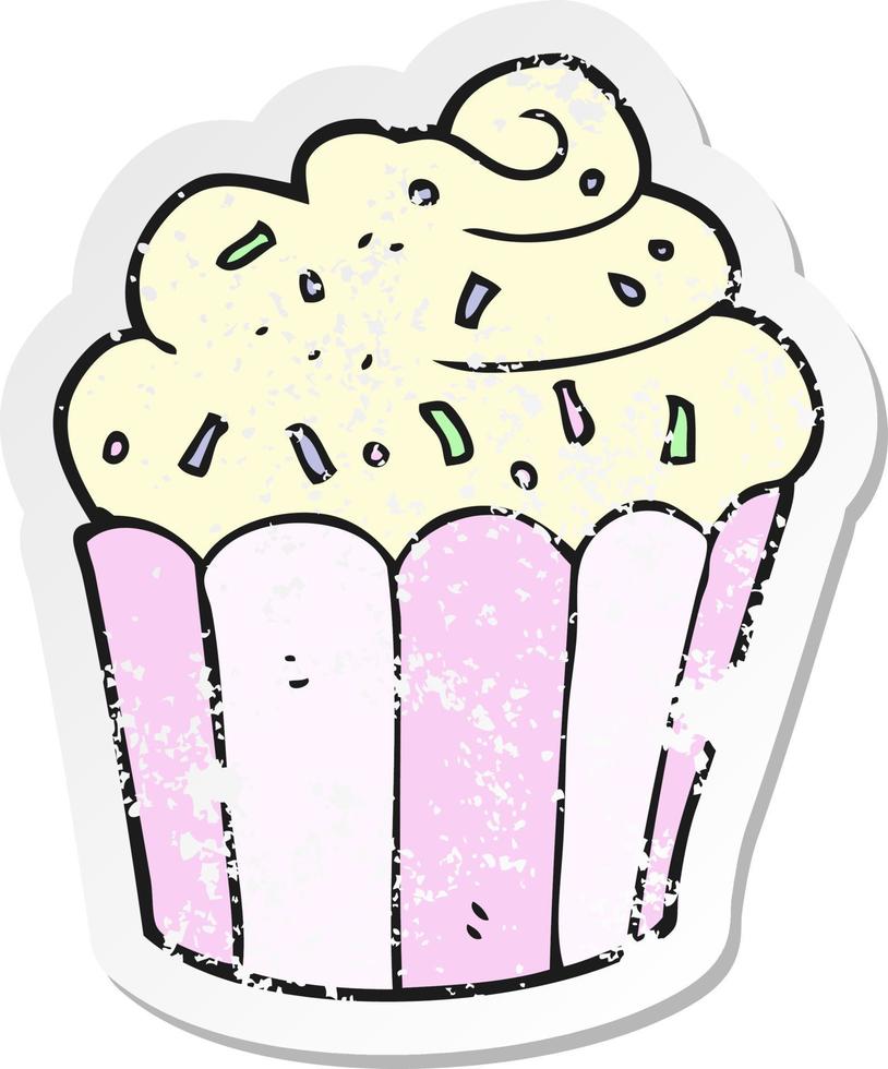 pegatina retro angustiada de un cupcake de dibujos animados vector