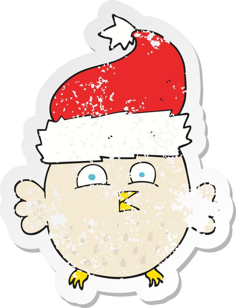 retro distressed sticker of a cartoon owl wearing christmas hat vector