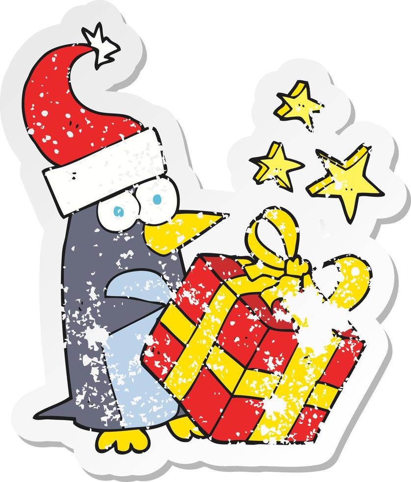 retro distressed sticker of a cartoon christmas penguin with present vector