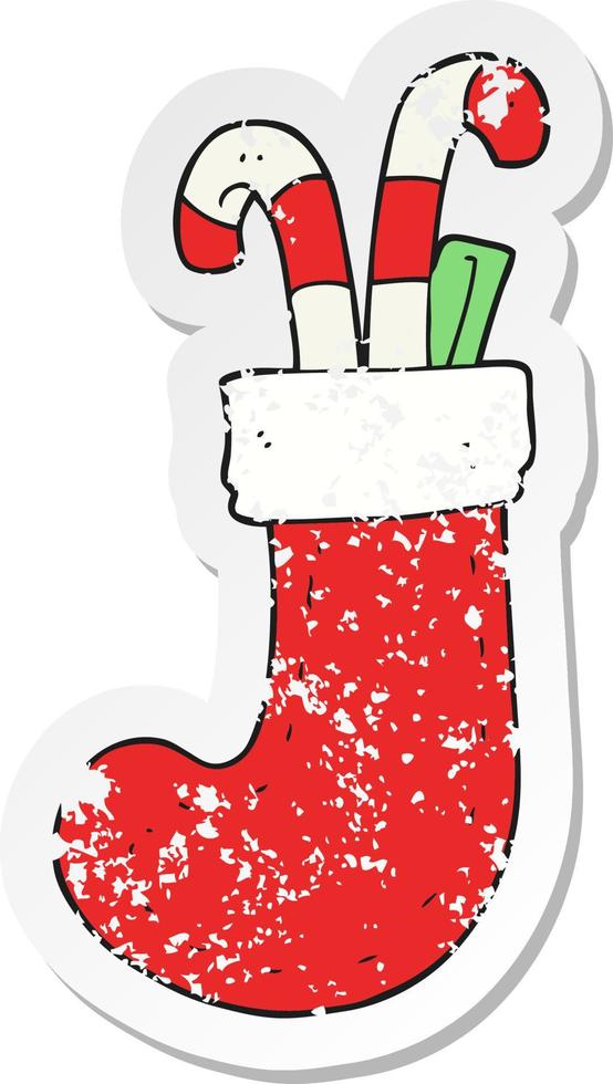 retro distressed sticker of a cartoon christmas stocking vector