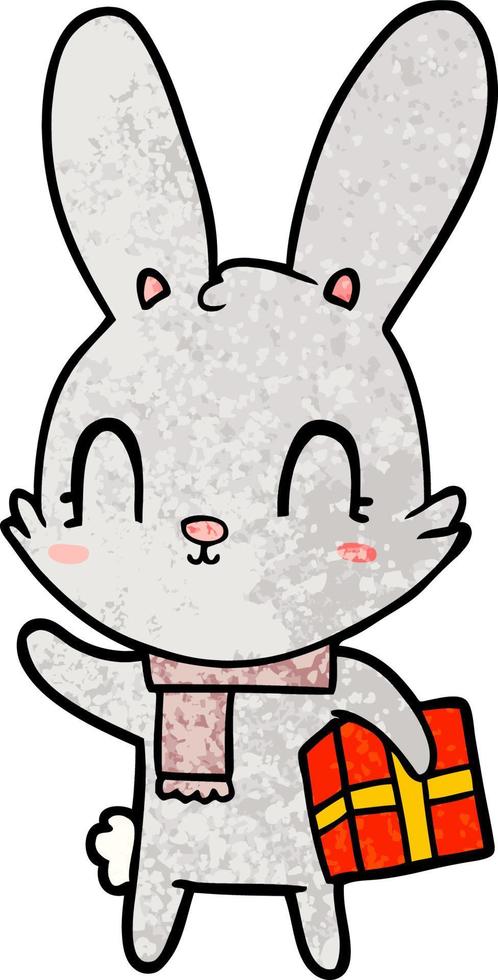 lindo conejo de dibujos animados con regalo de navidad vector