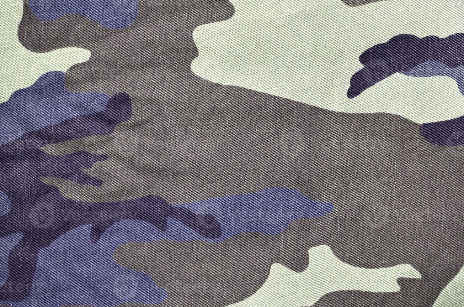 Texture of fabric with a camouflage painted in colors of the marsh. Army background image photo