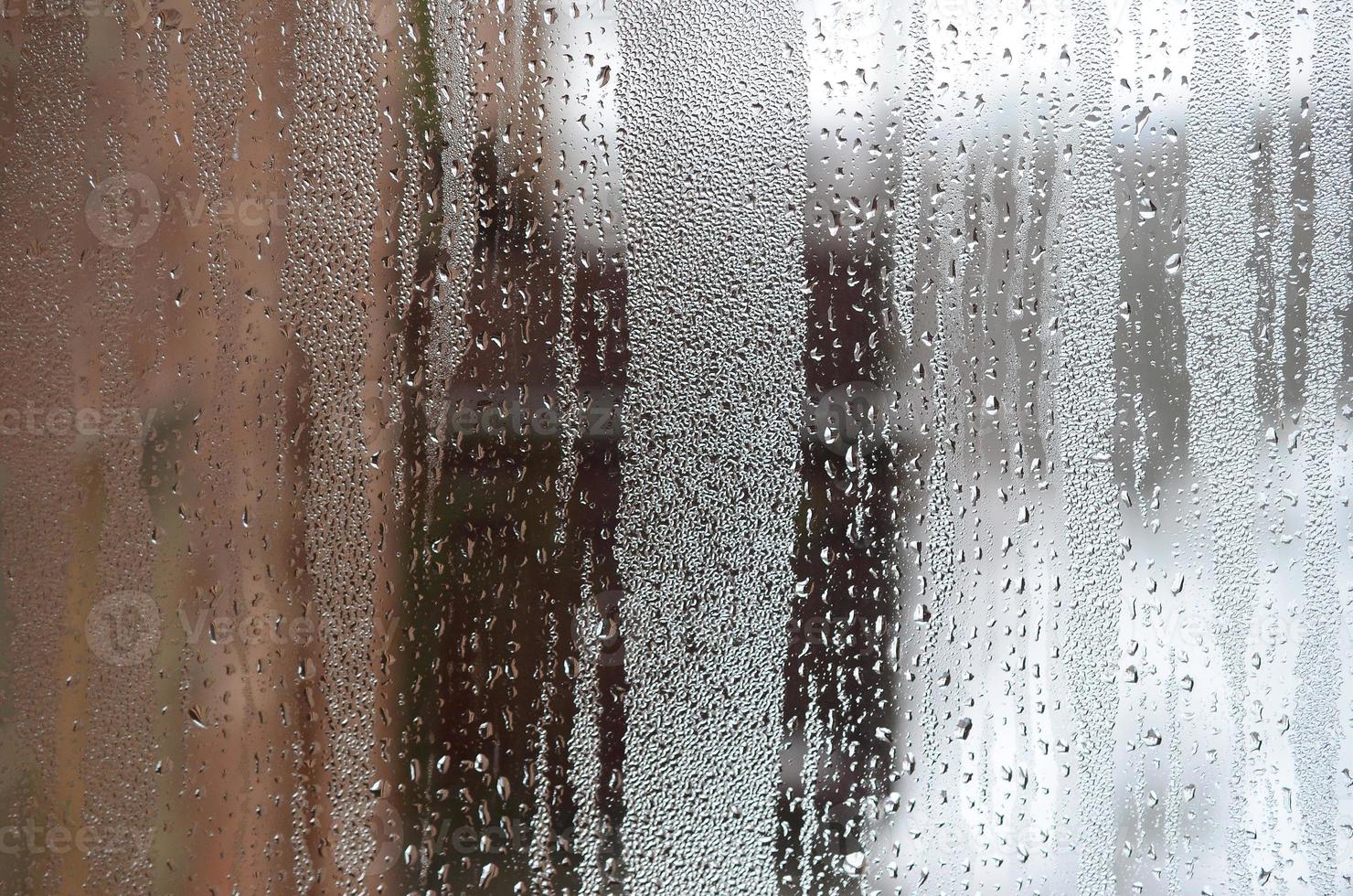 The texture of a misted glass with a lot of drops and condensation flows. Background image photo