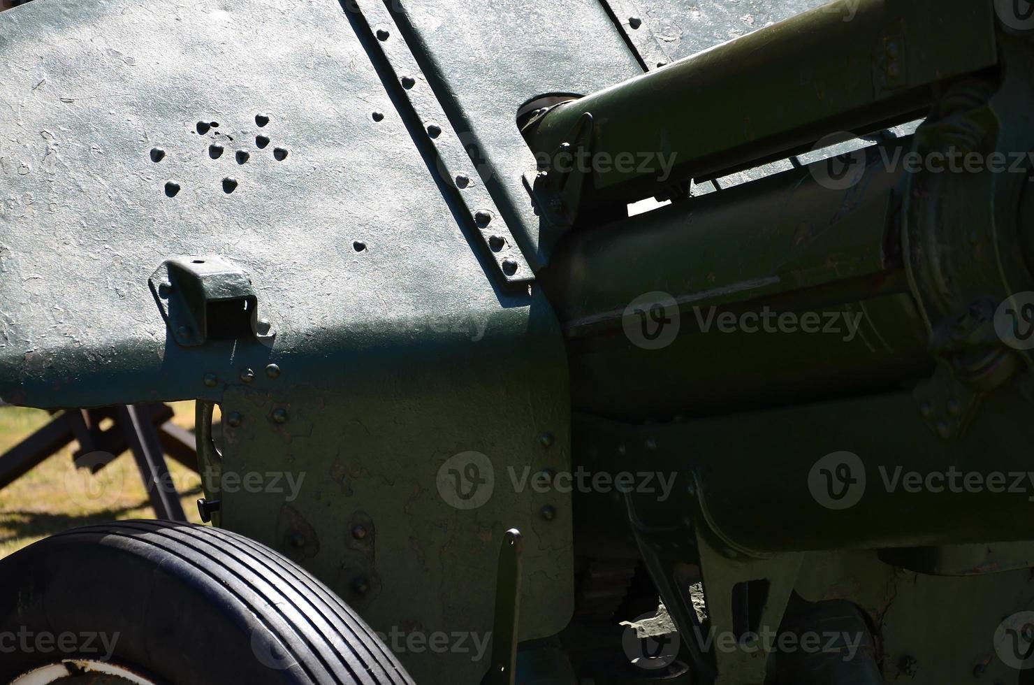 A close-up mechanism of a portable weapon of the Soviet Union of World War II, painted in a dark green color photo