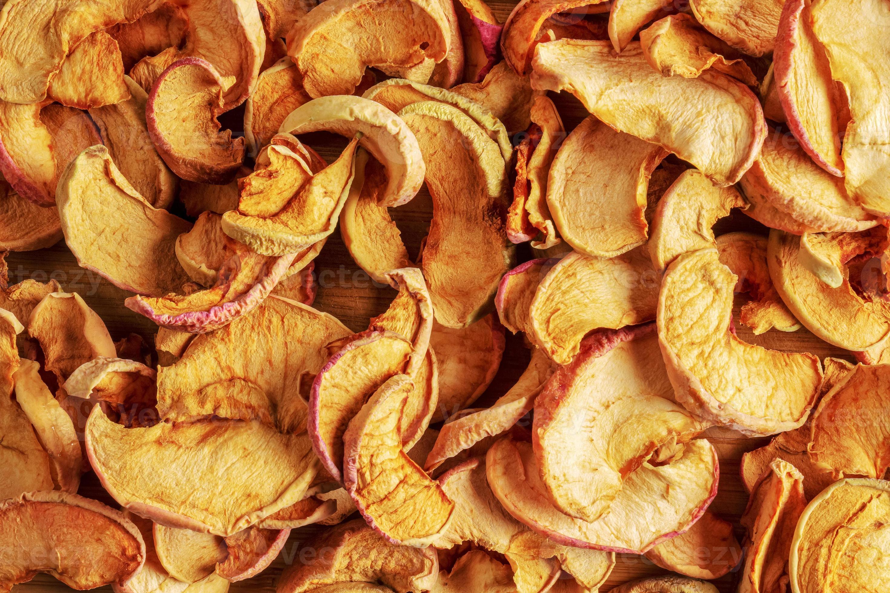 Background of dried apple slices. Chips from dried fruits. Healthy food