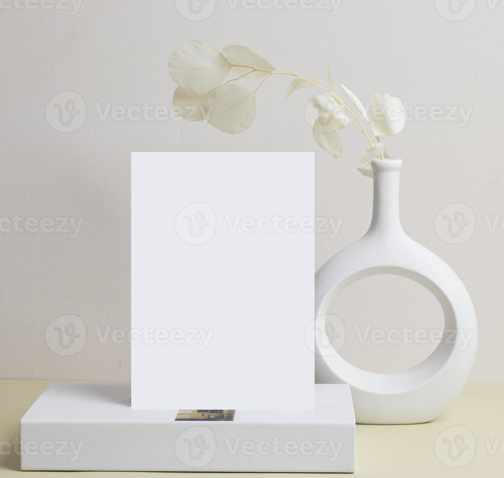 greeting card front view and dry flower in vase ceramic on table photo