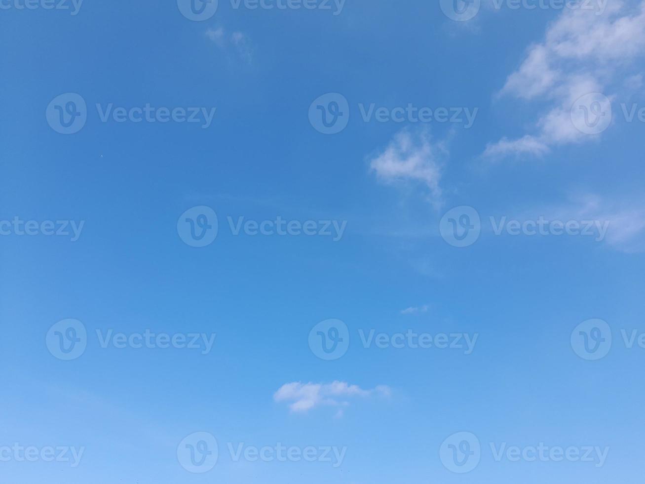 blue sky with puffy clouds photo