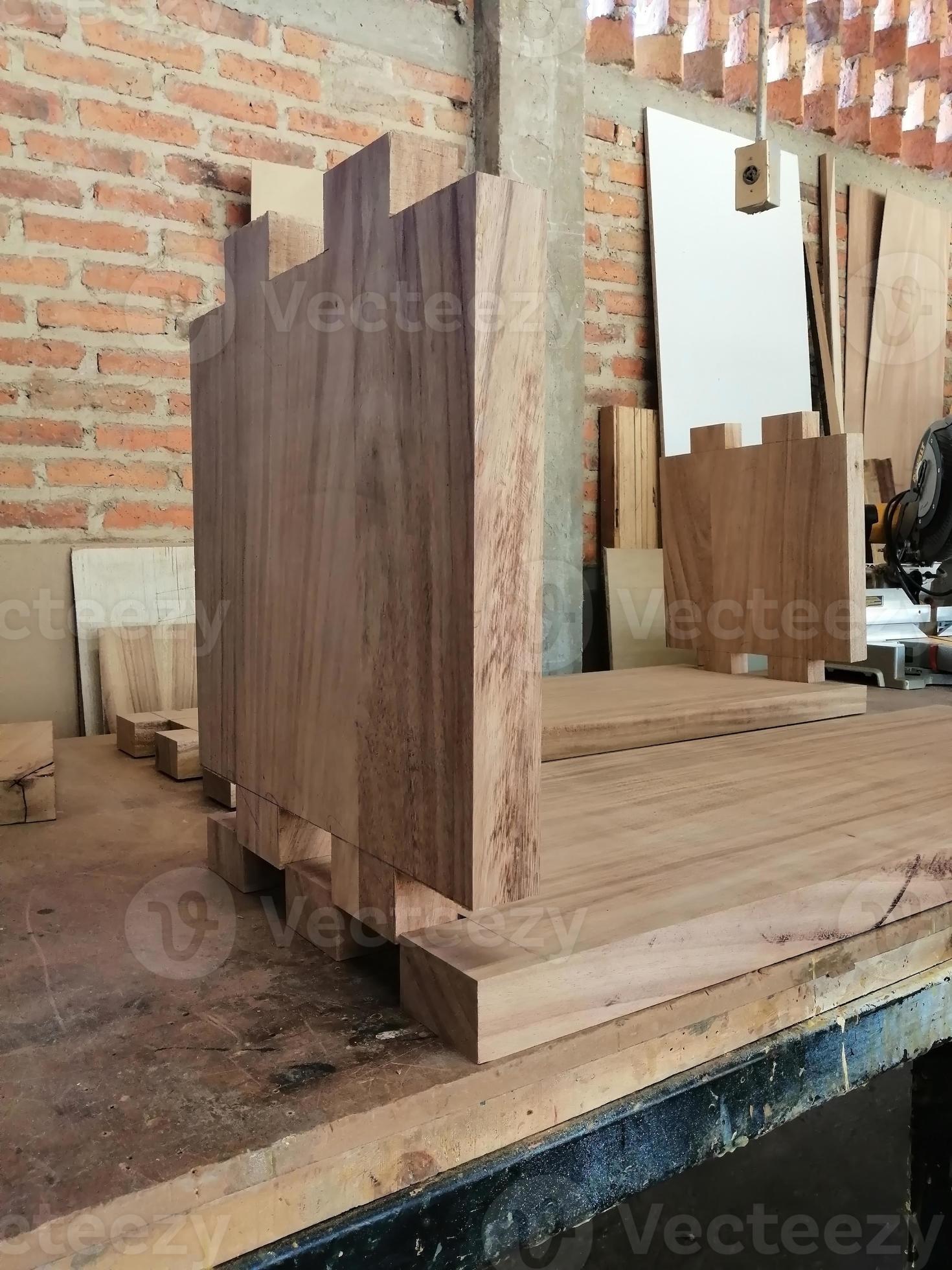wood piece with dovetail attachment. Dovetail joint on working table