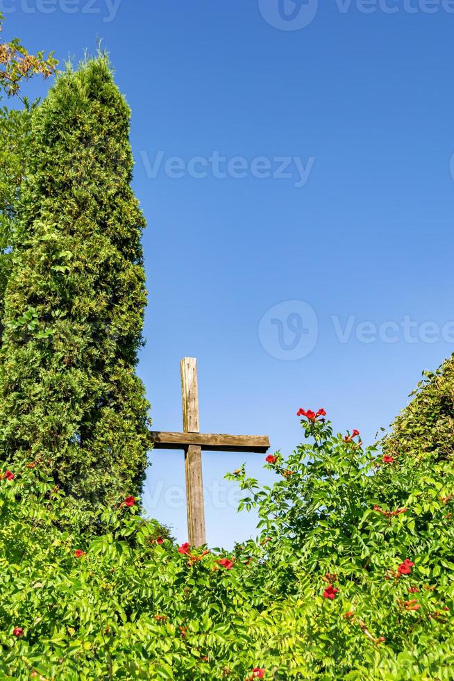 Christian church cross in high steeple tower for prayer photo