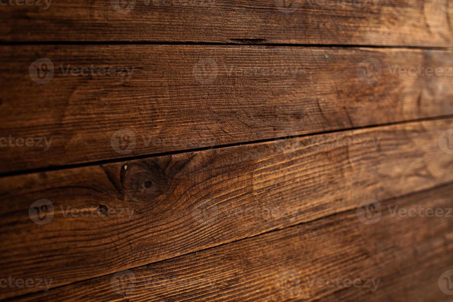 textura de fondo de madera de color vintage con nudos y agujeros de clavos. antigua pared de madera pintada. tableros horizontales oscuros de madera. vista frontal con espacio de copia. foto