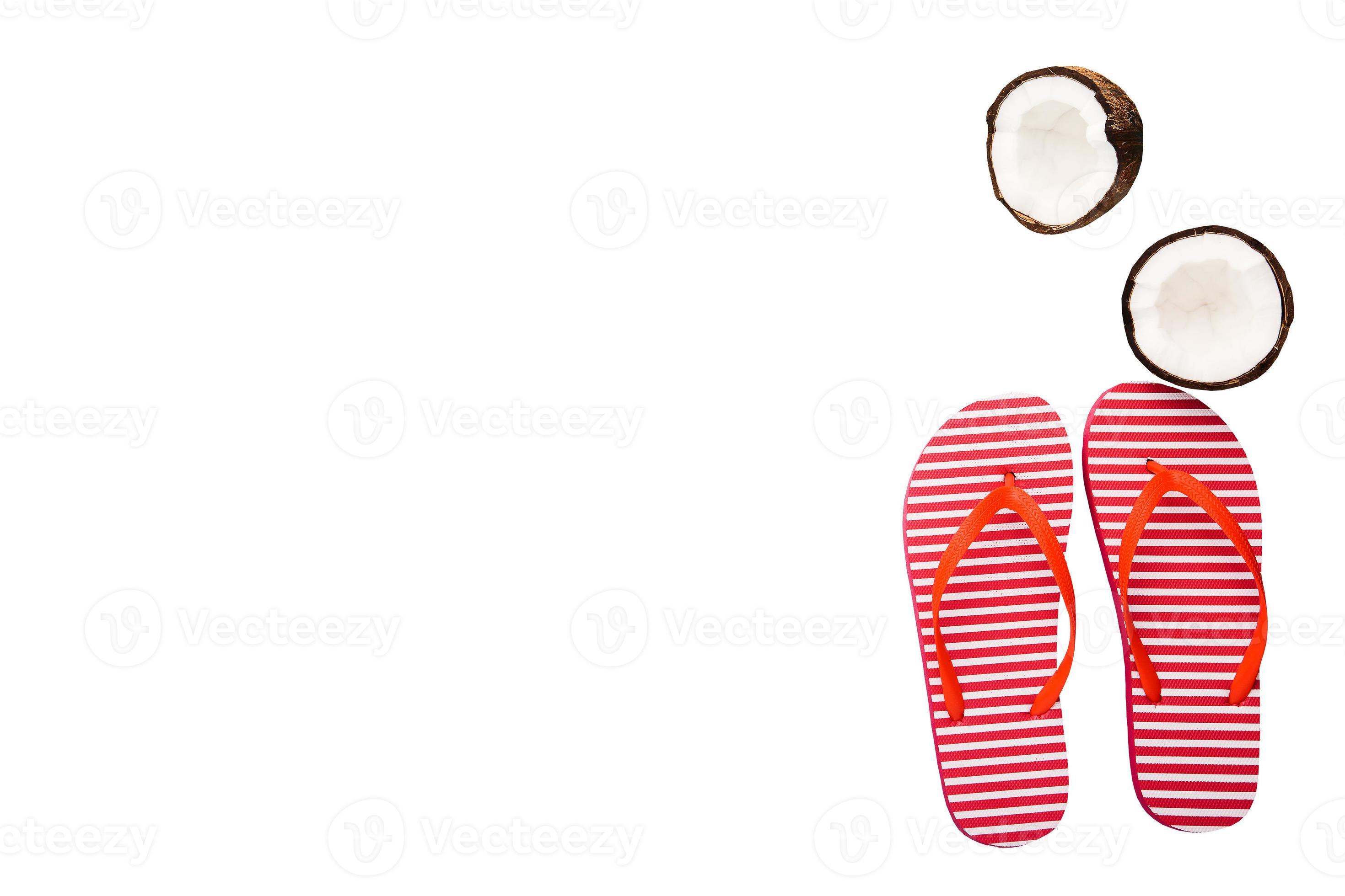 Summer accessories. Coconuts and flip flops isolated on white