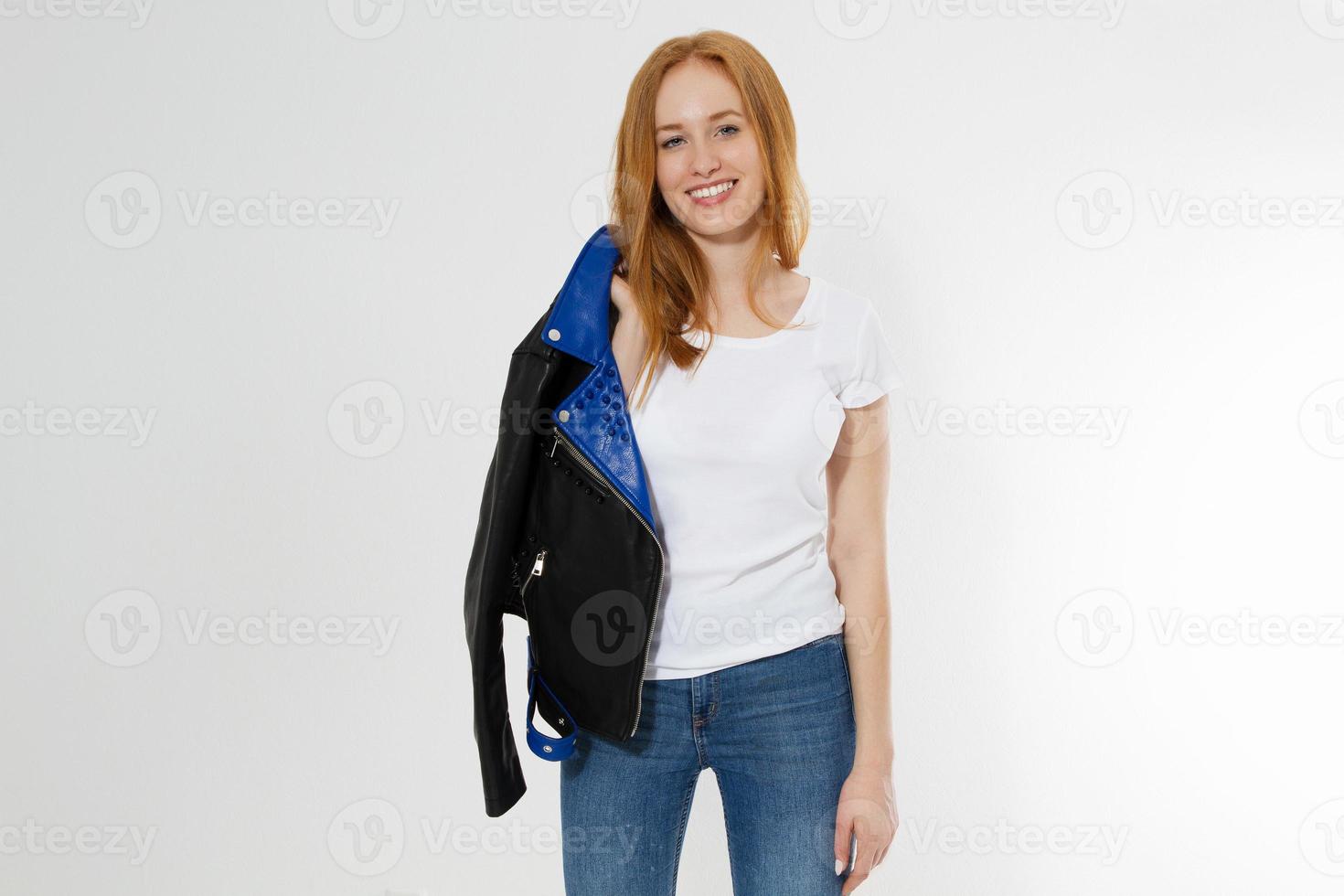Happy Excited Young Woman in white t shirt and black leather jacket isolated on white background. Red hair girl in fashion clothes front view. Blank template summer t-shirt. Copy space photo