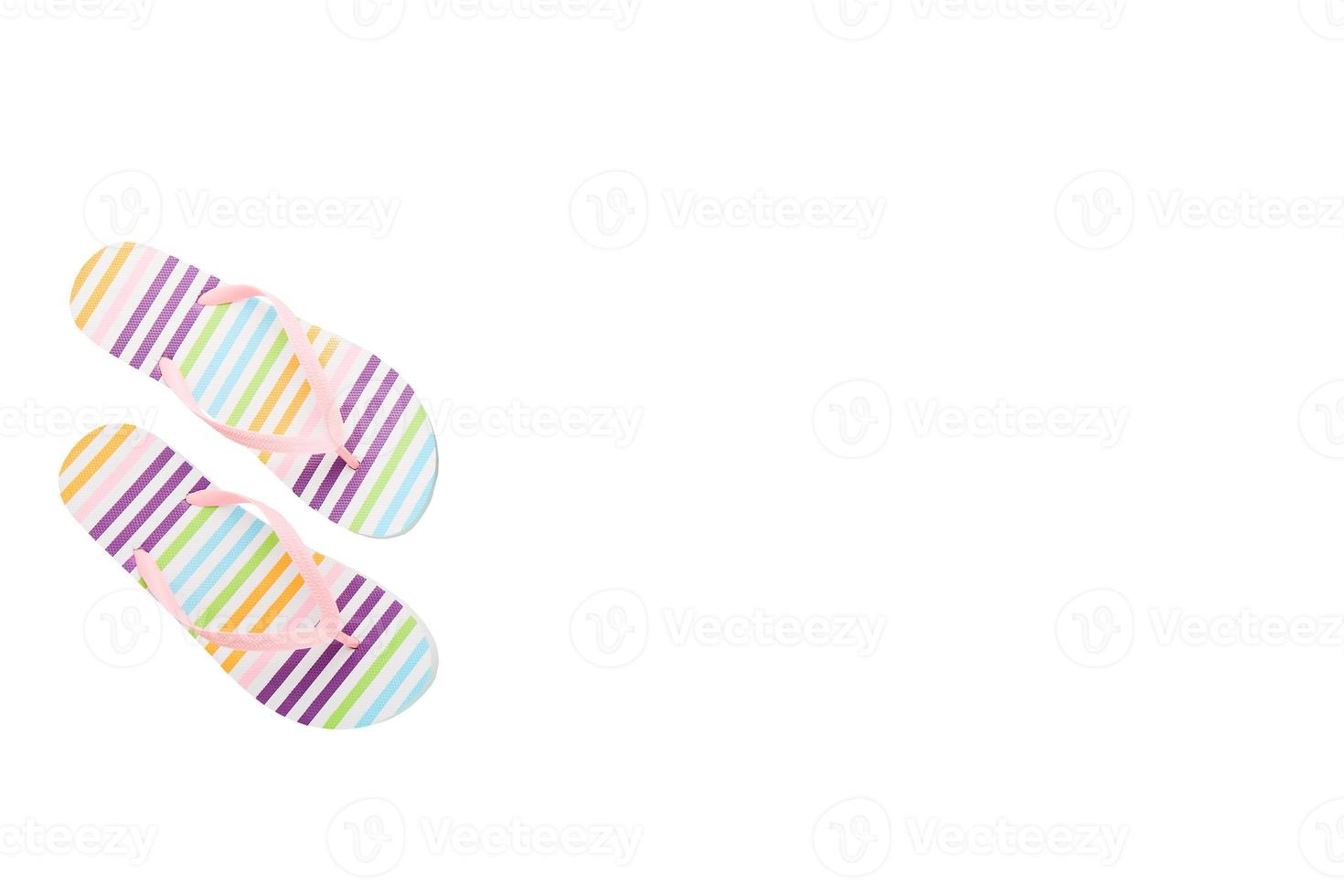 Striped summer shoes. Flip flops isolated on white. Summertime concept. Top view and copy space. Fashion slippers photo