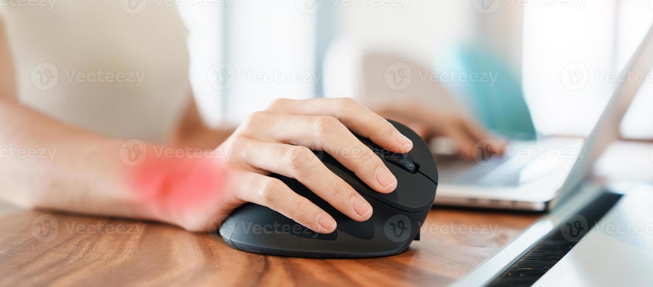 woman hand using computer ergonomic mouse, prevention wrist pain because working long time. De Quervain s tenosynovitis, Intersection Symptom, Carpal Tunnel Syndrome or Office syndrome concept photo