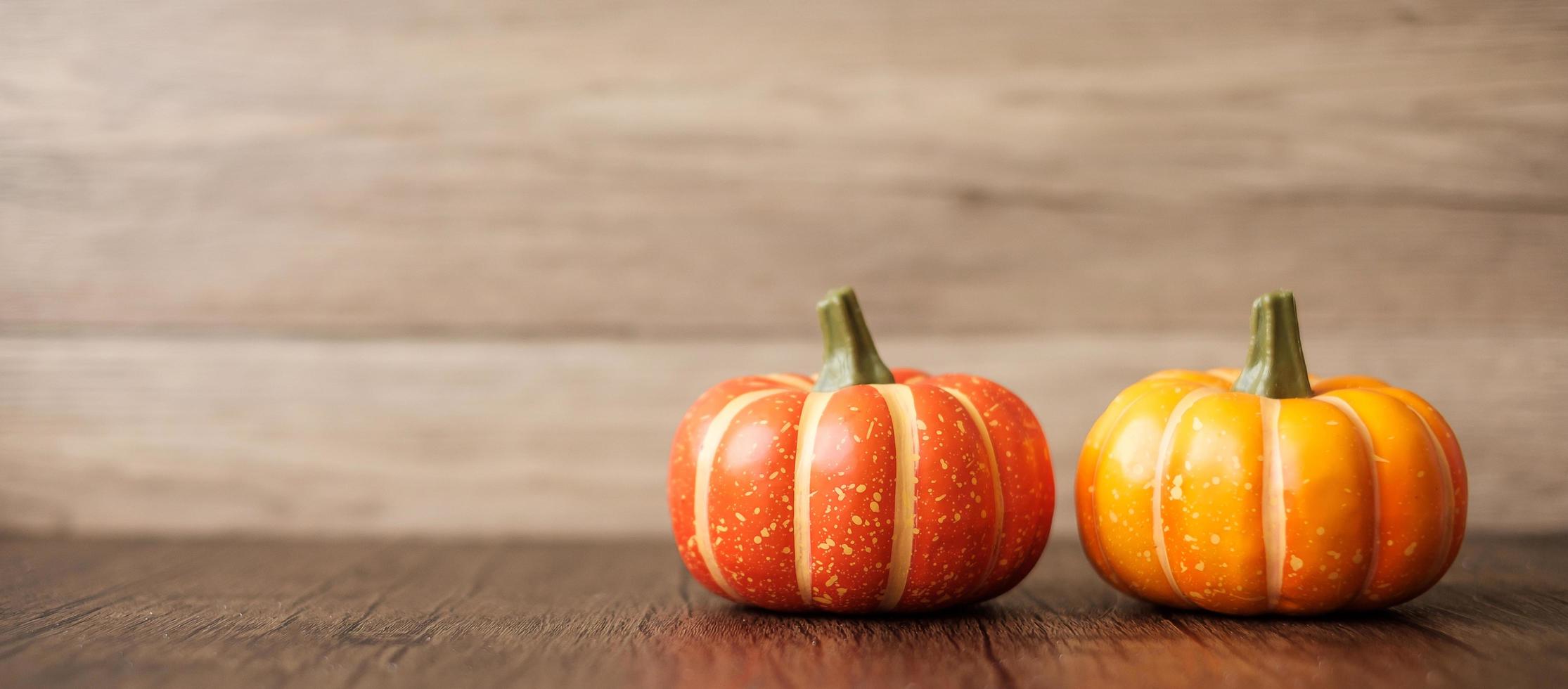 Orange pumpkin on table with copy space for banner background. Happy Halloween day, Hello October, fall autumn season, Festive, party and holiday concept photo