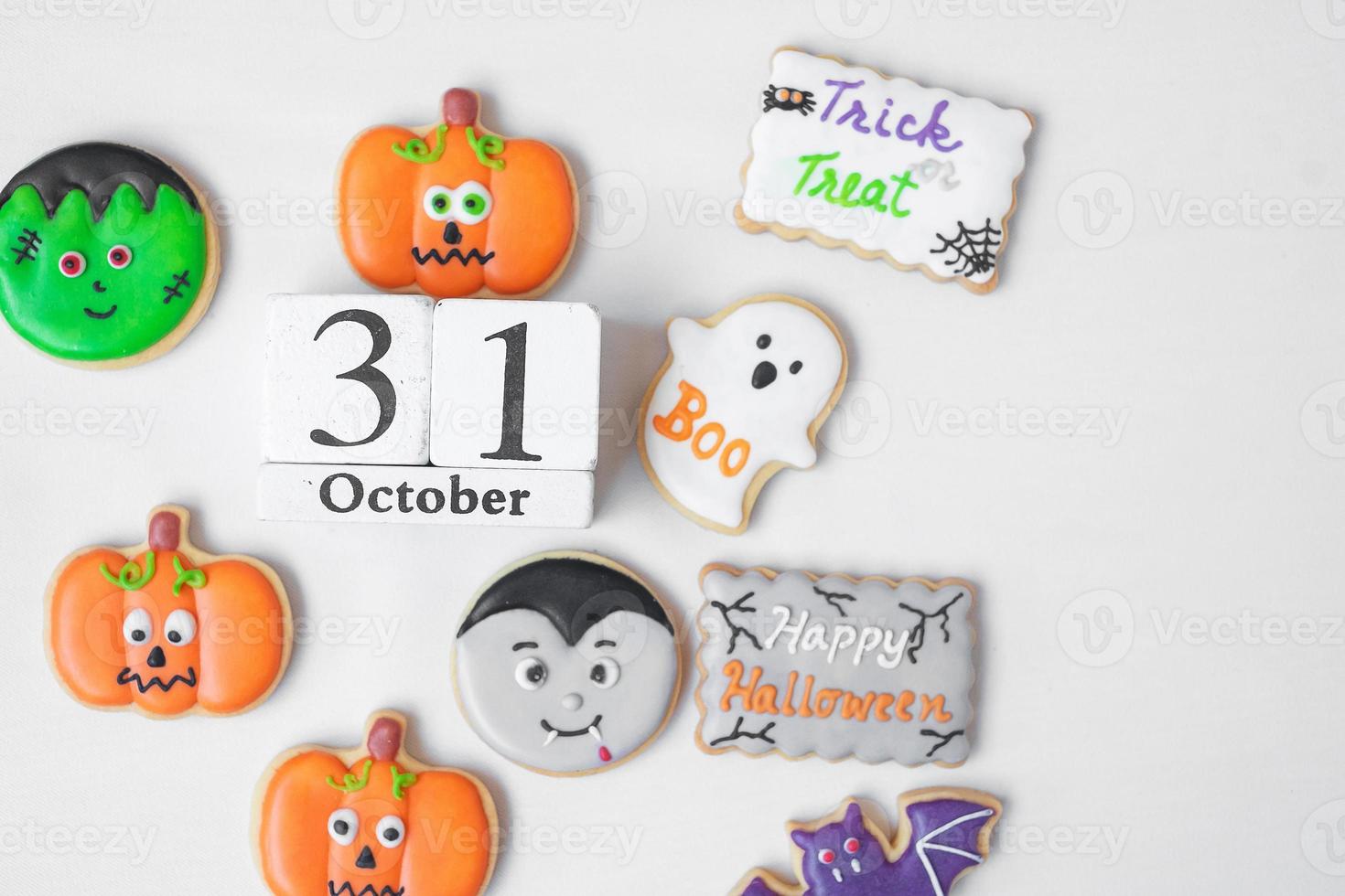 Halloween funny Cookies with 31 October calendar on white background. Trick or Threat, Happy Halloween, Hello October, fall autumn, Festive, party and holiday concept photo
