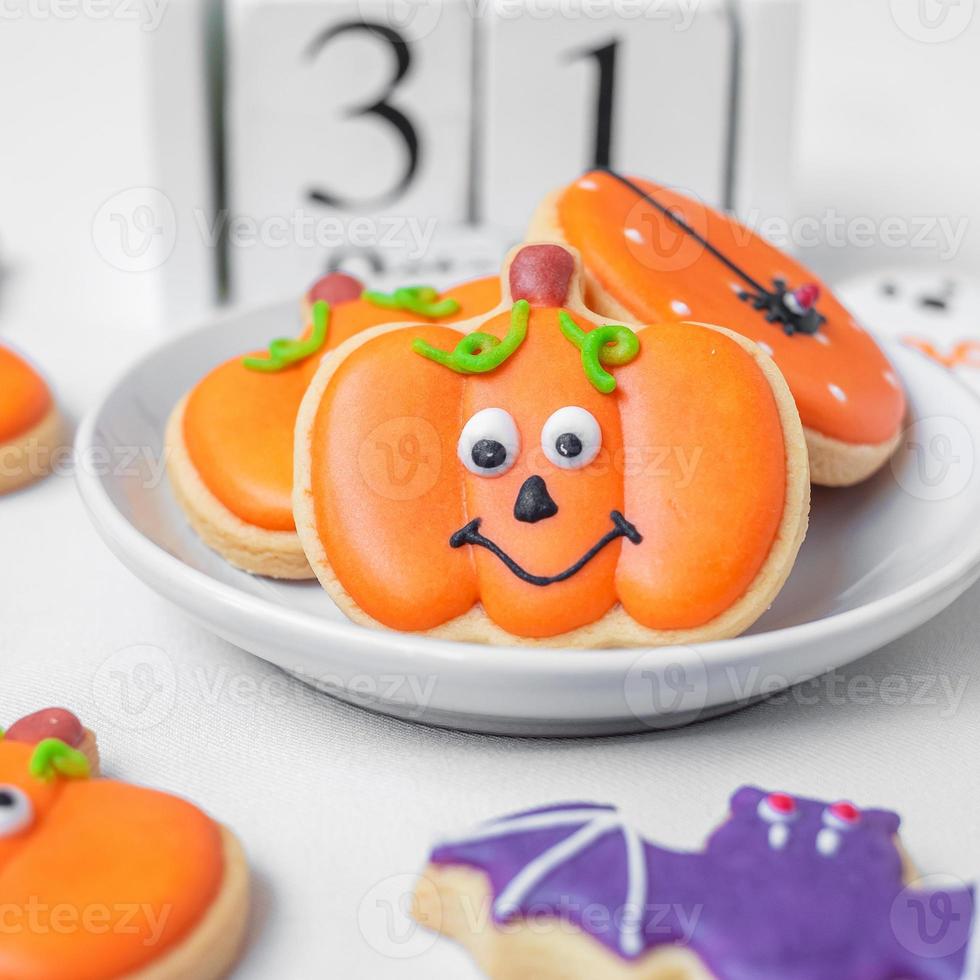Halloween funny Cookies with 31 October calendar on white background. Trick or Threat, Happy Halloween, Hello October, fall autumn, Festive, party and holiday concept photo