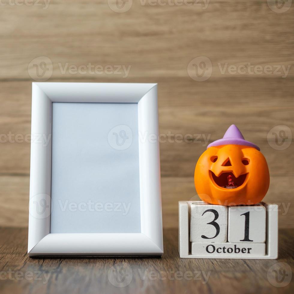 Orange pumpkin, 31 October calendar and frame with copy space for text. Happy Halloween day, Hello October, fall autumn season, Festive, party and holiday concept photo